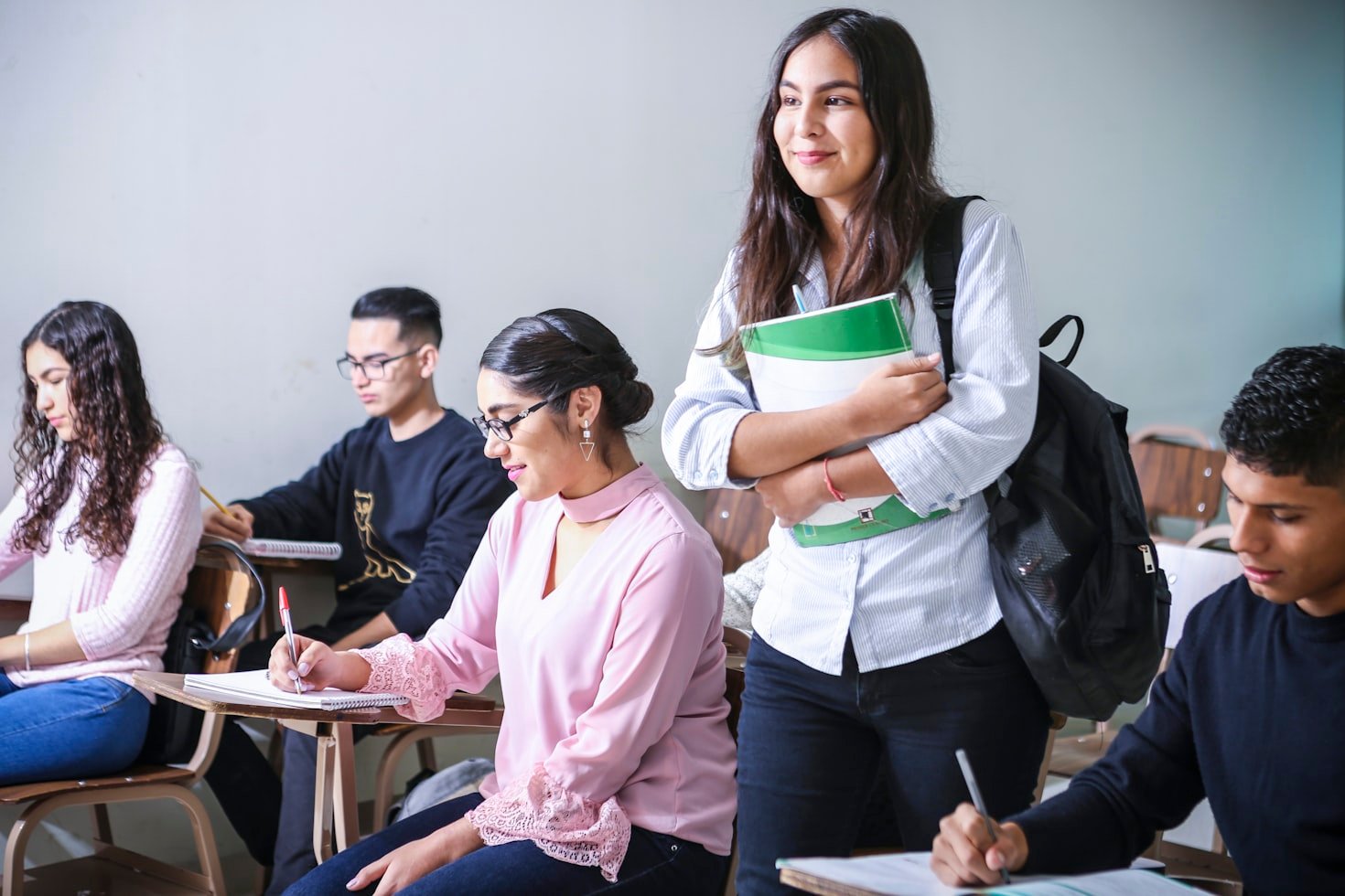 Students collaborating around a table in a university setting
